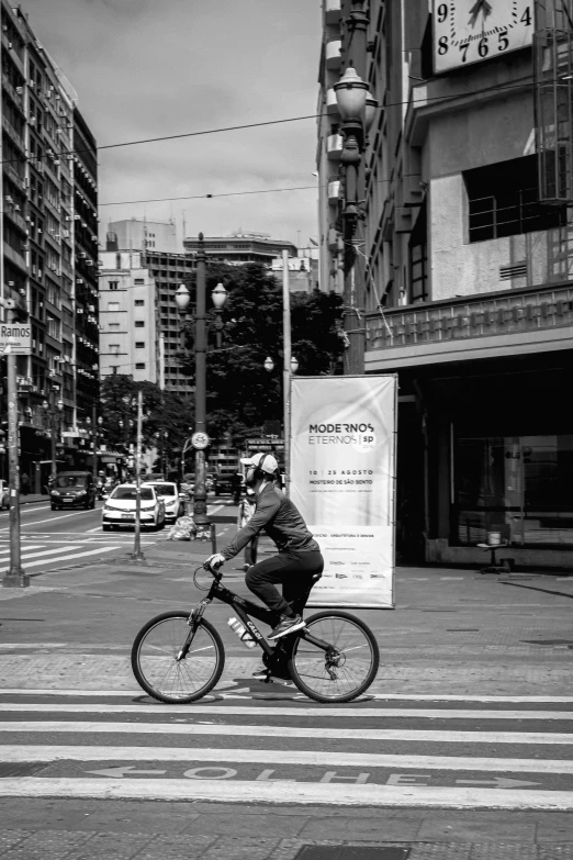 a man that is on a bike in the street