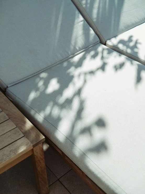 a patio table sitting underneath a white umbrella