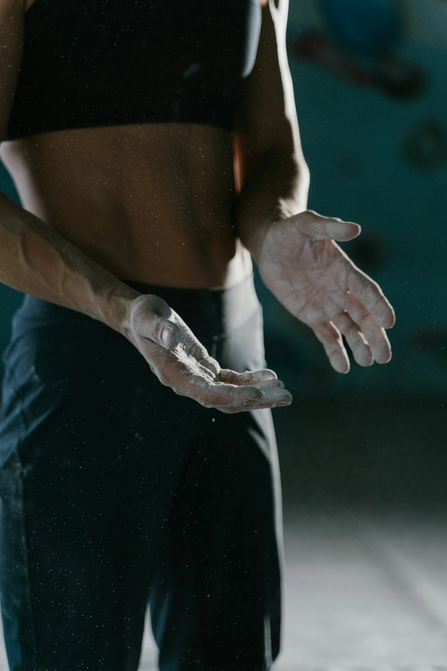 a woman doing exercise in a gym while showing off her toned stomach