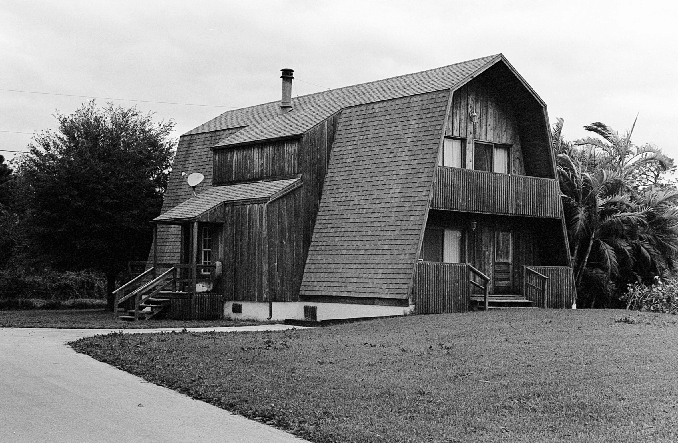 an old, wooden house has been painted black