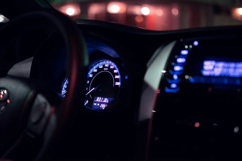 dashboard and instrument ons of car in a dark location