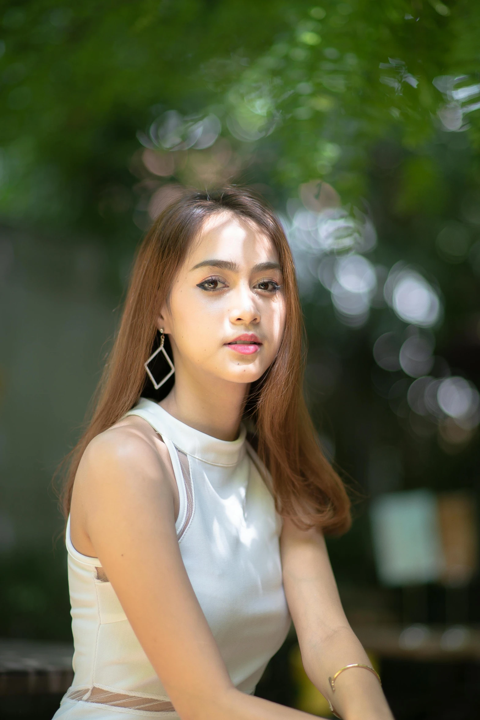 young woman with light skin looking away from the camera