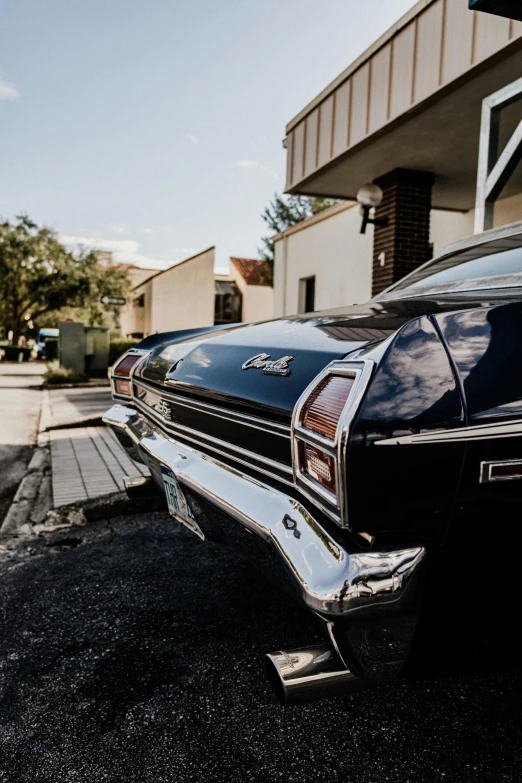 a vintage car parked on the side of the street