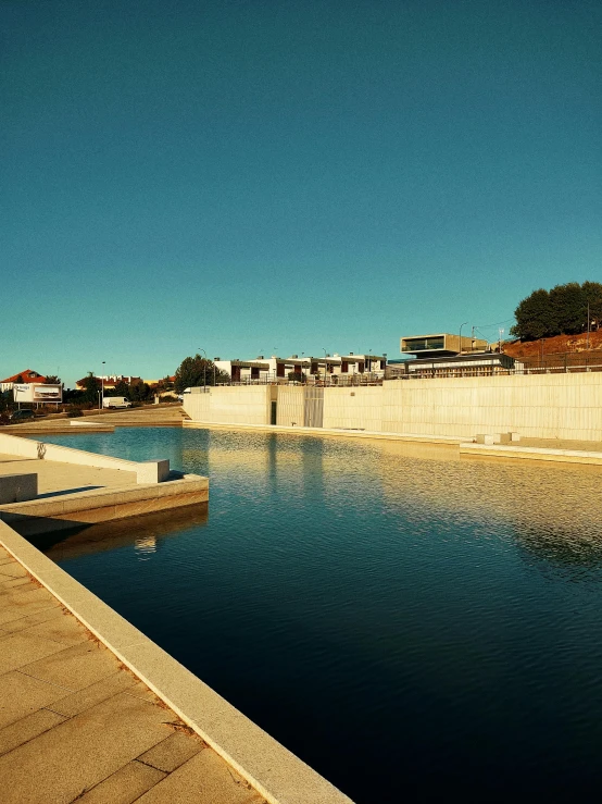 an empty pool surrounded by cement barriers