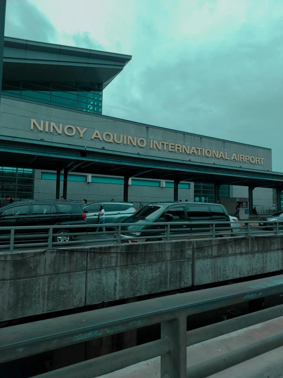 a building with large windows near parking lots