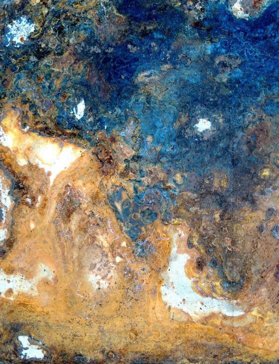 a brown blue and white stone surface with a design