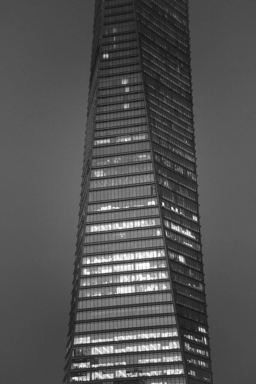 the shardle building lit up in the night time