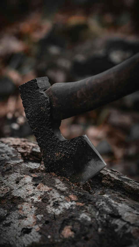 an axe and two large, dark axes stuck together