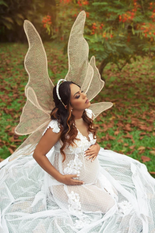 the woman wearing white has her hands on her hip while she is posing in the air