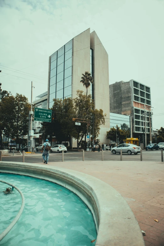 a swimming pool in front of an apartment building