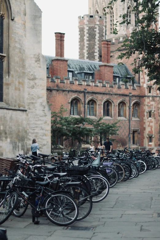 many bicycles sitting outside in front of a church
