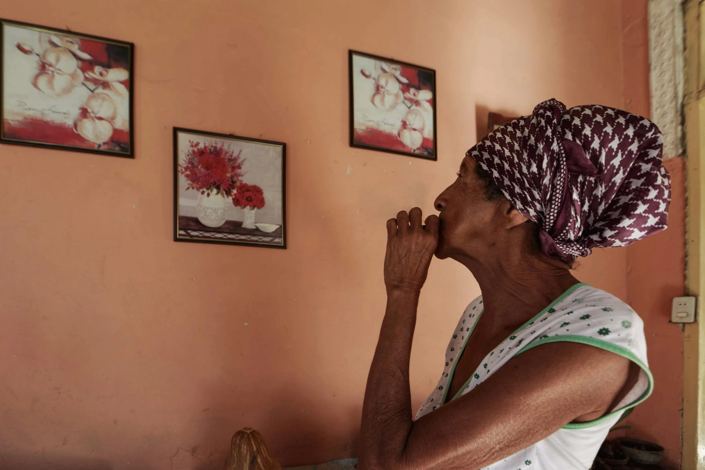 a woman is standing and looking up at some pos