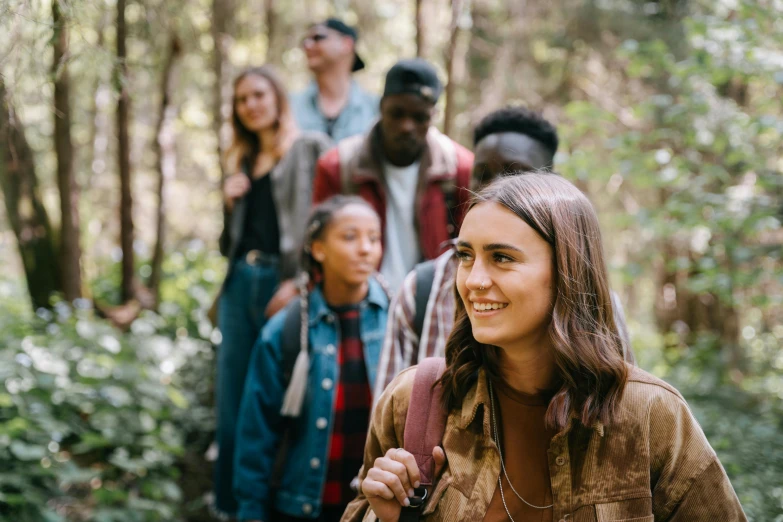 a group of people hiking through the woods