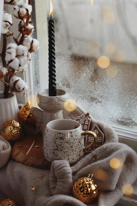 a view outside the window, shows the blanket and two candles