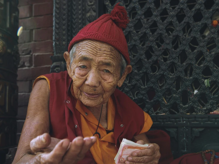 a very old man with soing in his hand