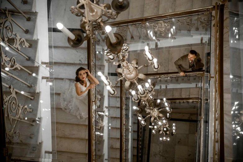 a woman in a dress taking a picture of herself in the mirror