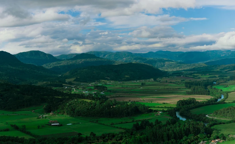 landscape in the mountains with some trees and houses