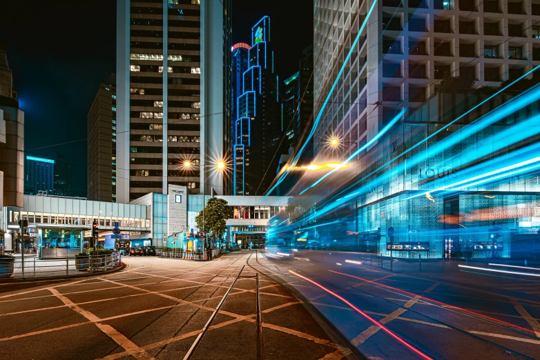 an urban street with buildings and blue lighting