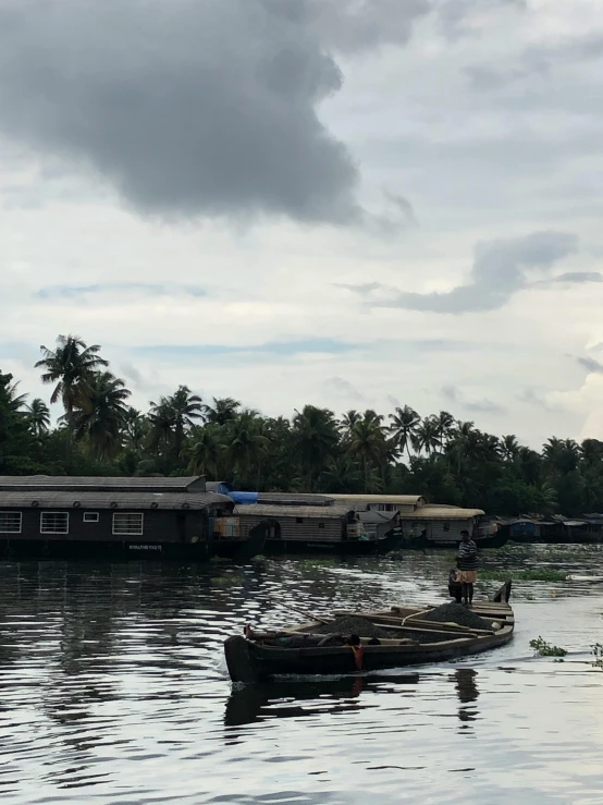 two boats with passengers traveling down the river