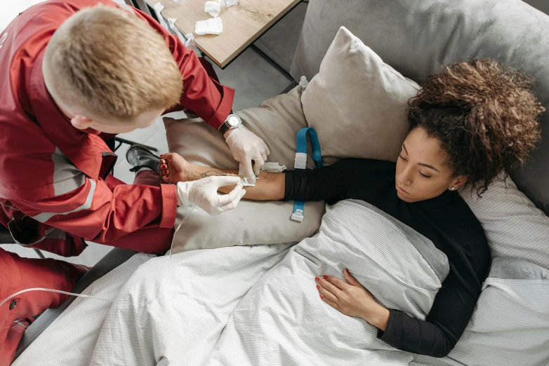 a couple is doing medical work on someones stomach