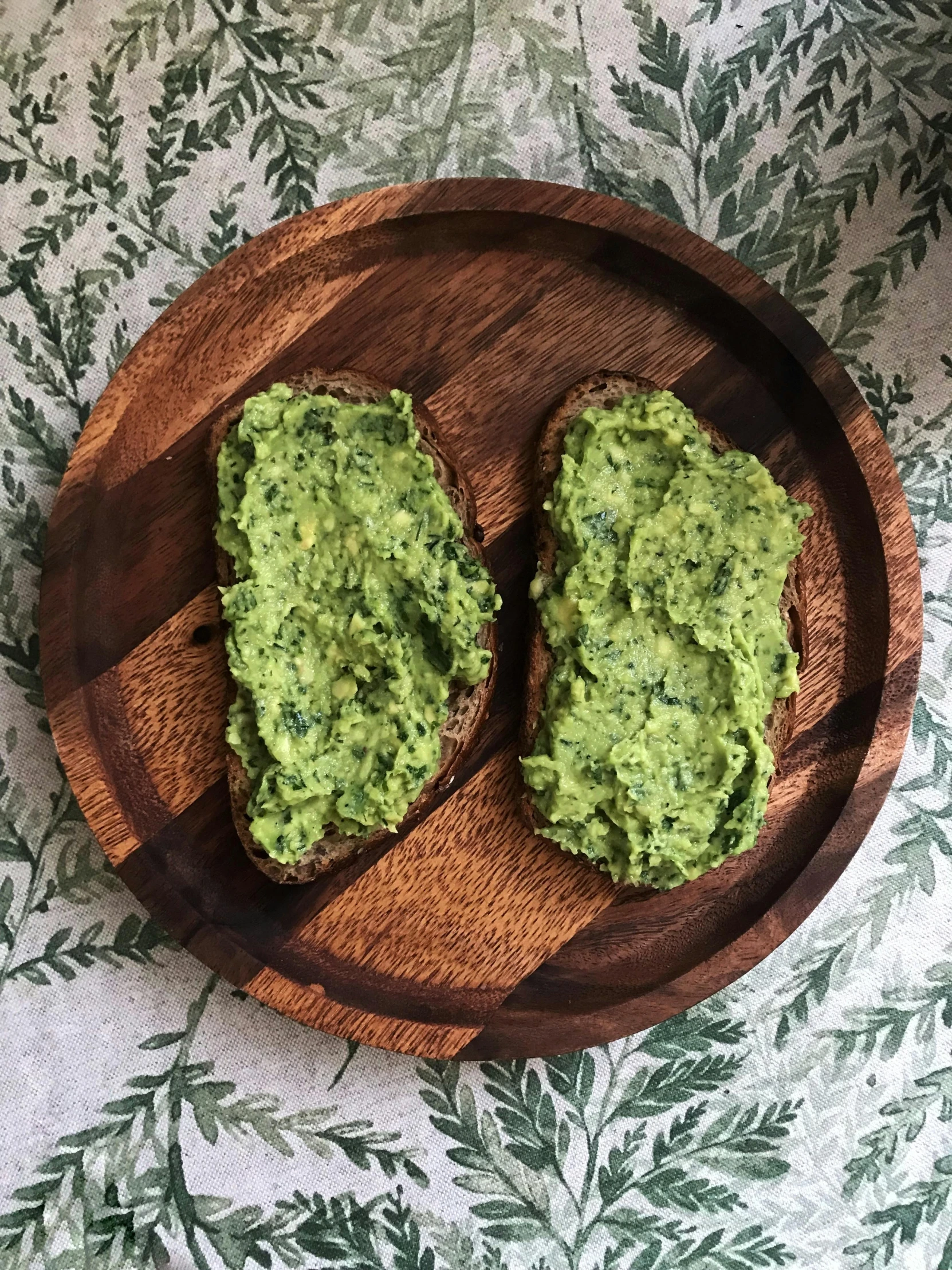 an open face sandwich with pesto on it