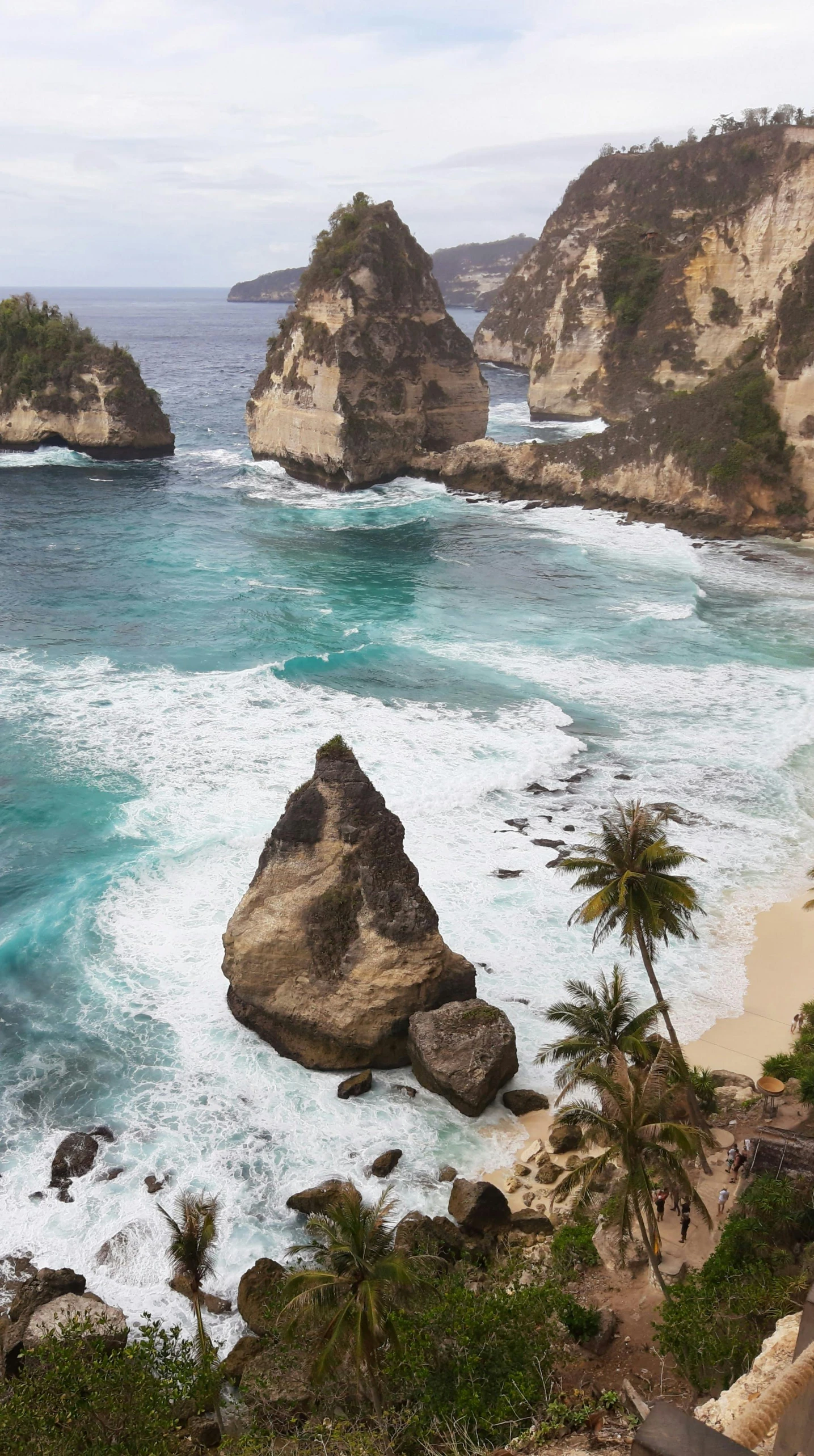 two large rocks on the ocean shore