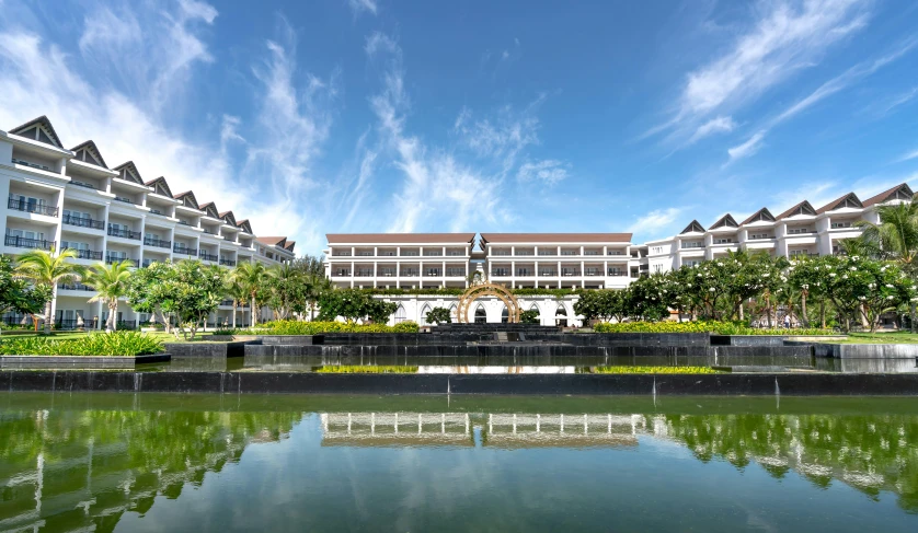 a lake in front of some large buildings