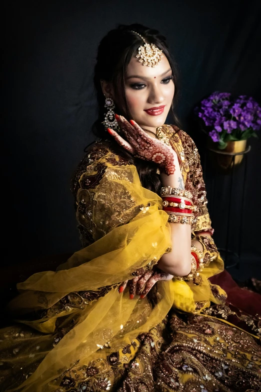 a woman in a bridal outfit posing for a po