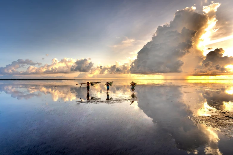 two people standing in the middle of water