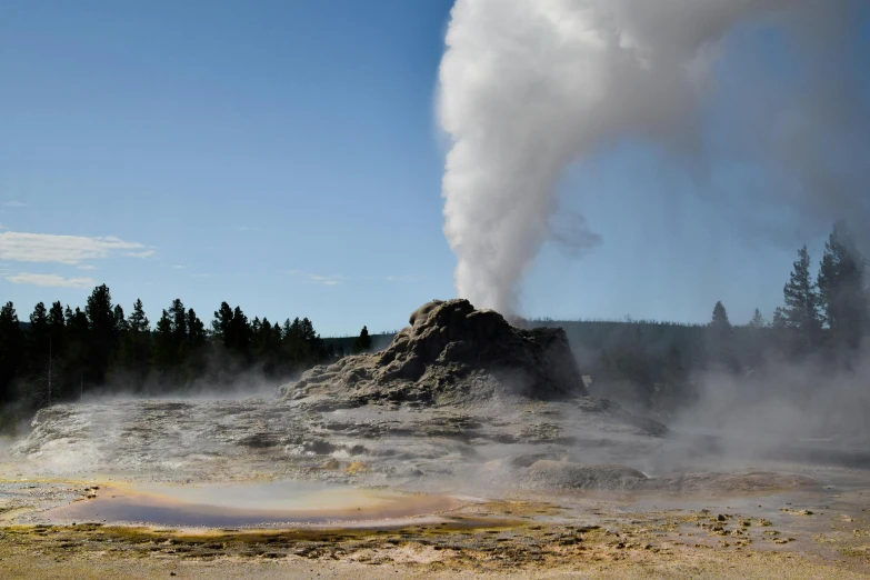 an overview view of the steaming geysers from the ground