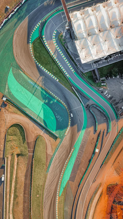 there is a very steep race track that has been painted green