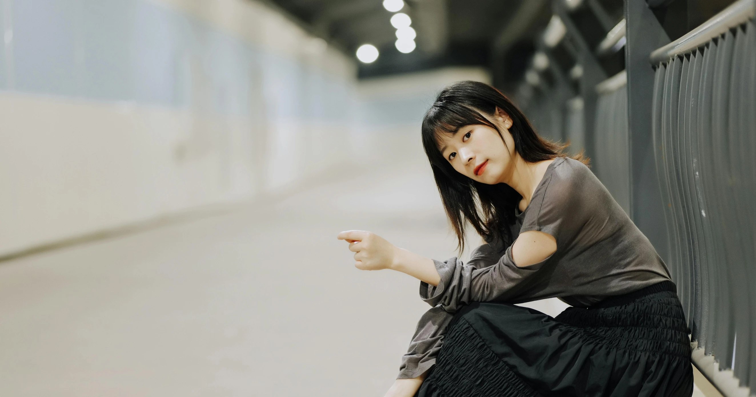 a woman kneeling down and holding her leg on the side