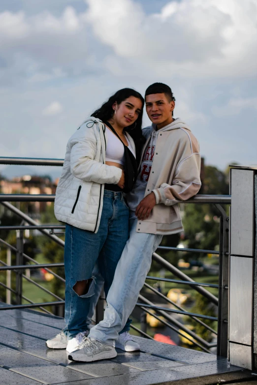 a man and a woman that are posing for the camera