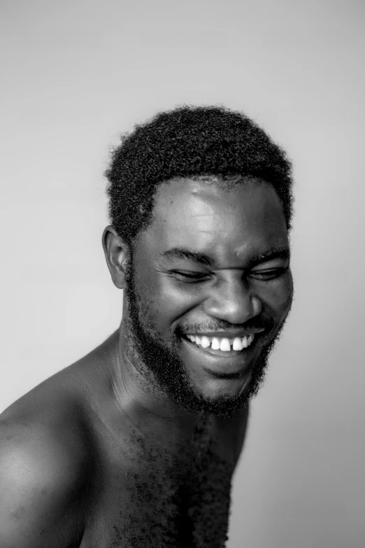 a man smiling wearing a fake beard and big eyes