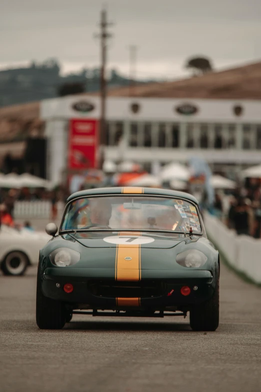 an old sports car sitting at the start line