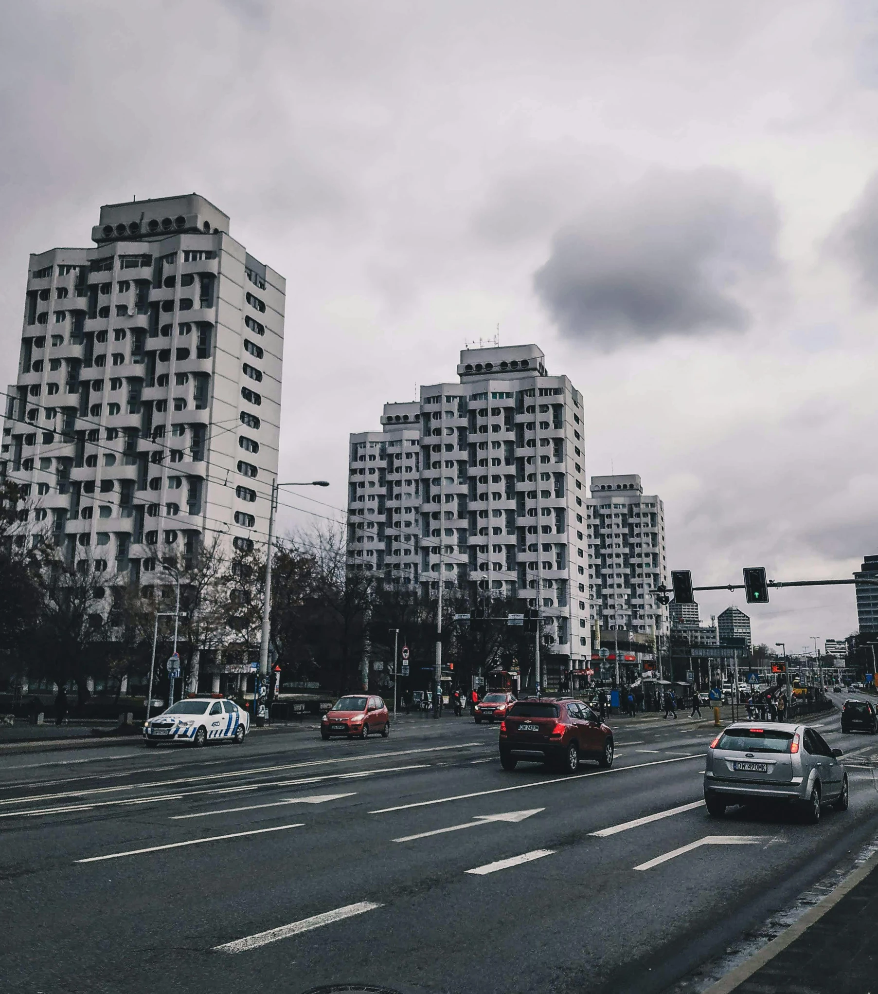 many tall buildings with large windows are in the distance