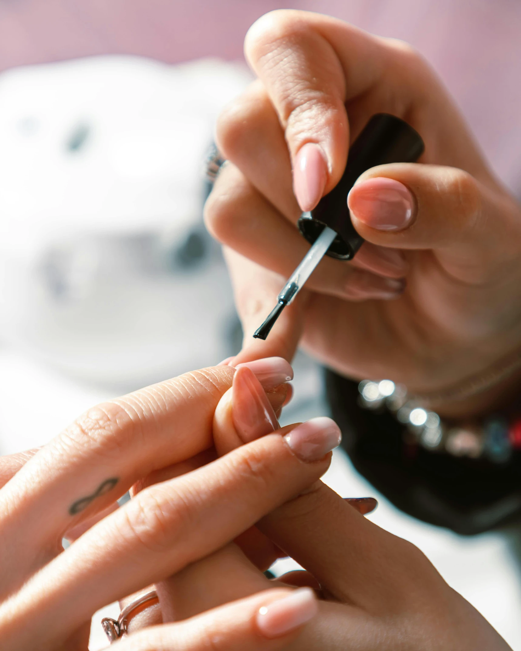 a woman getting her nails done in the salon