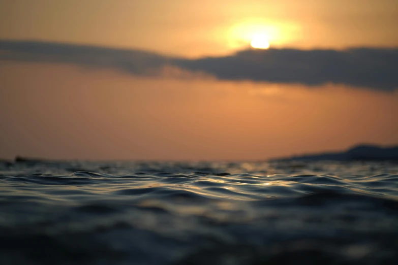 a beautiful sunset in the background as seen from a boat