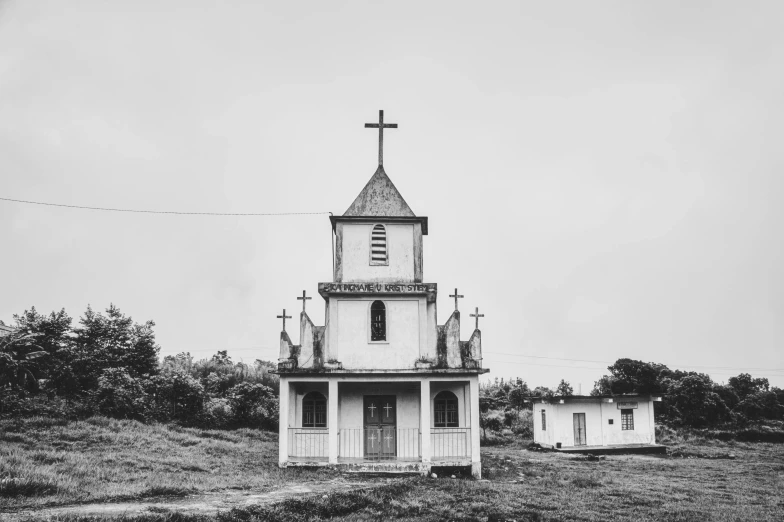 a black and white image of two old wooden buildings