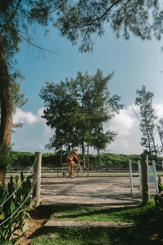 an adult riding a horse around in the grass