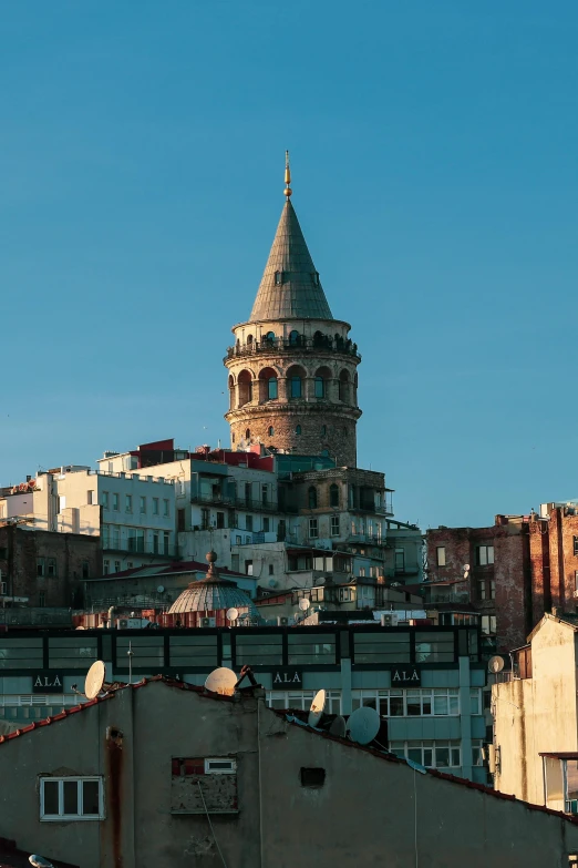 a large tower that has a spire sitting above it