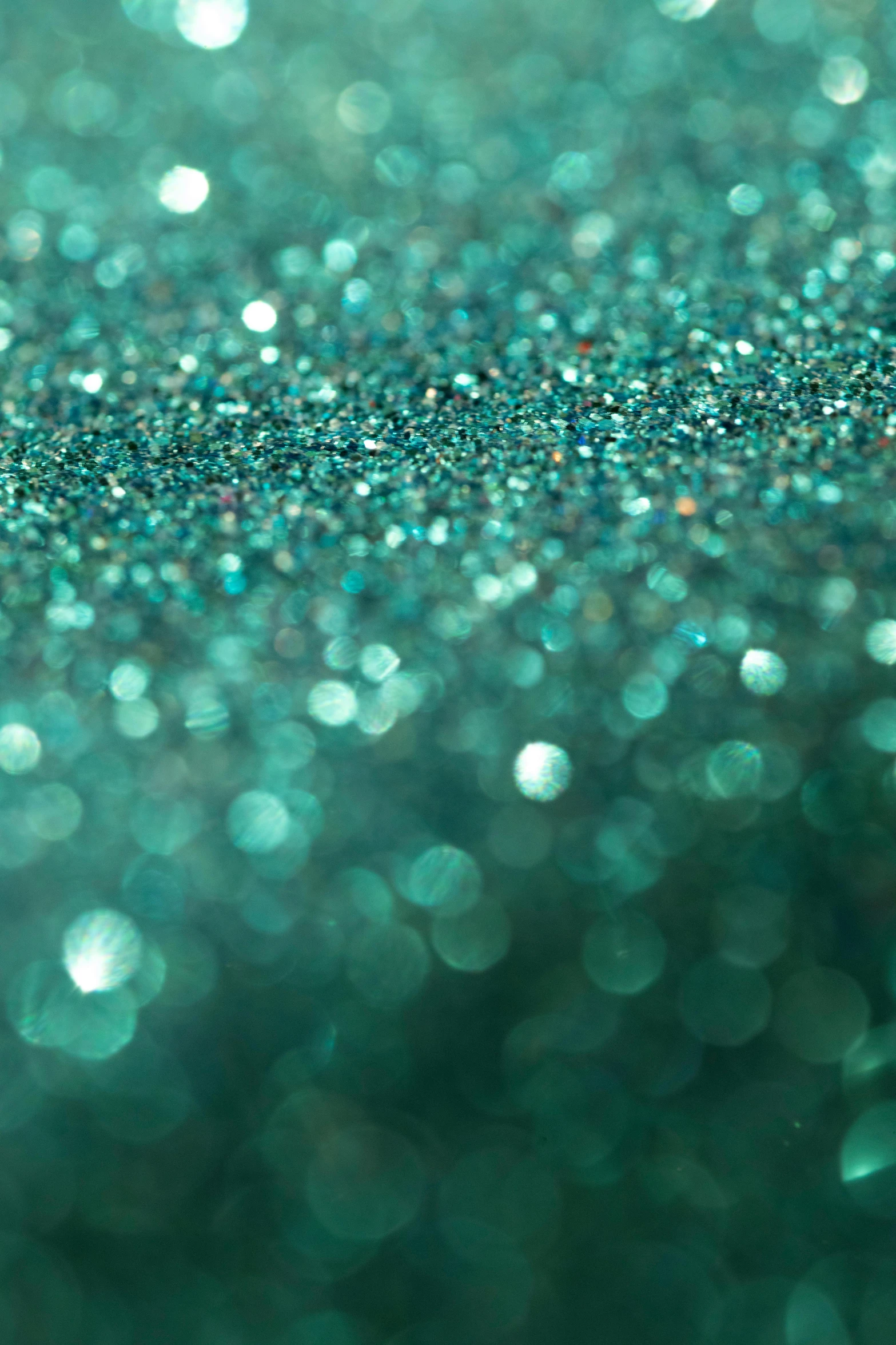 an abstract green sparkle background with lots of tiny sparkle