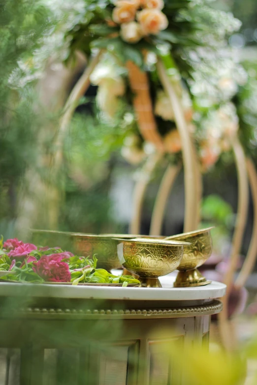 a cup, saucer and bowl of various vegetables on a table