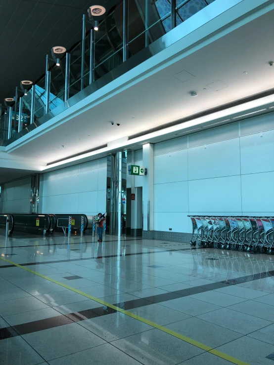 an airport lobby has two elevators and bicycles