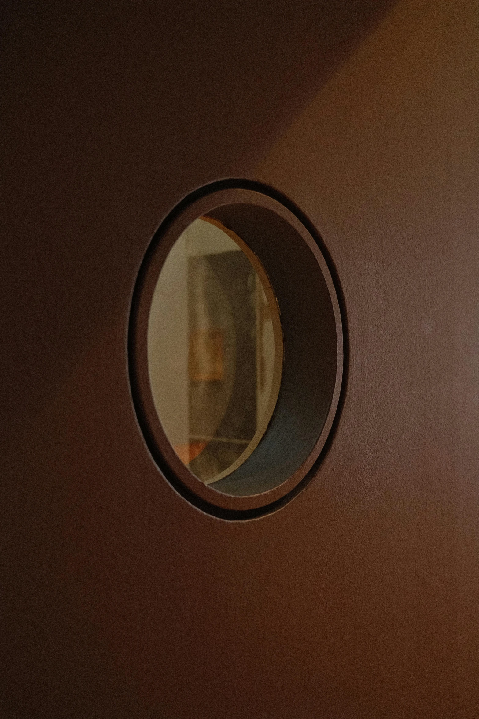 the front of a door with a circular window