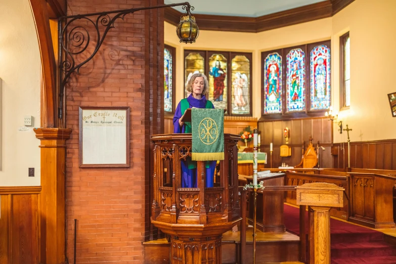 an older woman at the alter in a church