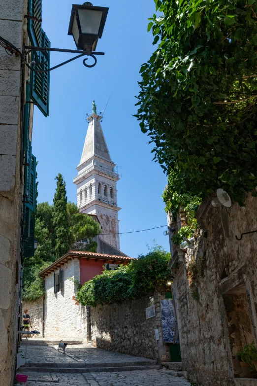 a stone street with an old church on one corner