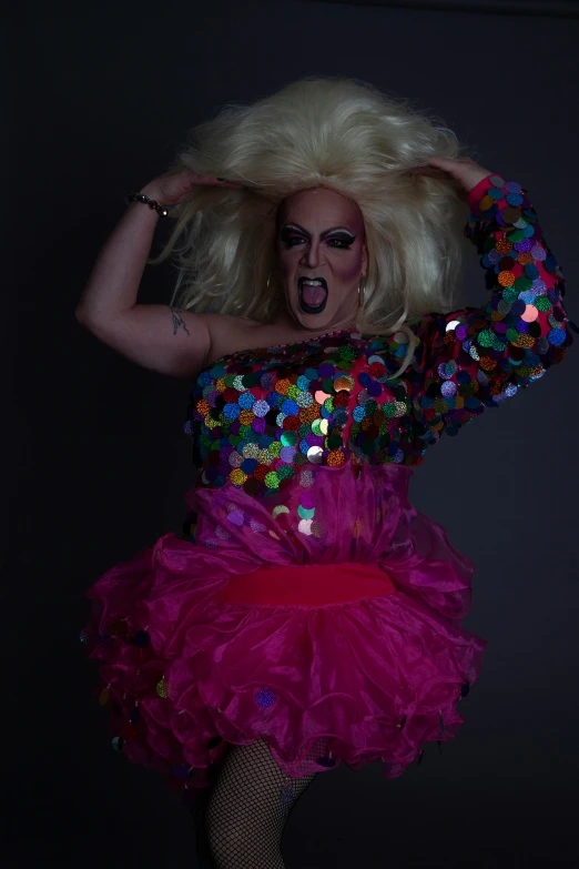 a woman dressed in costume and with drag makeup