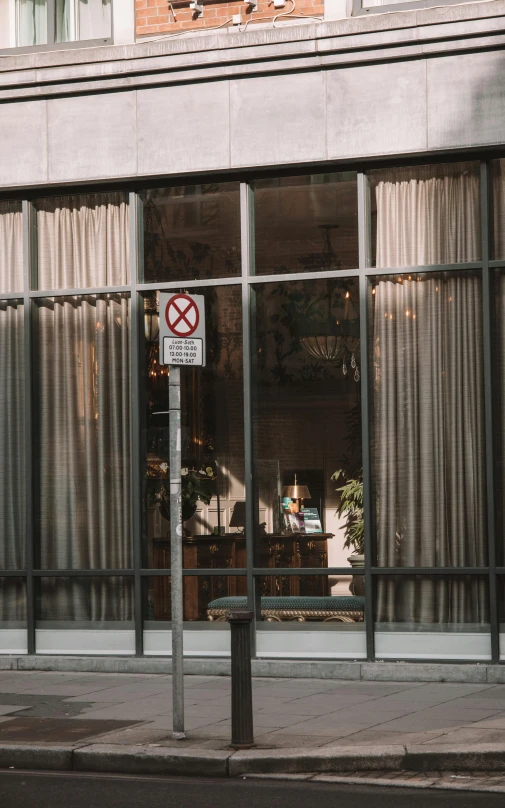 a no smoking sign is sitting outside a store