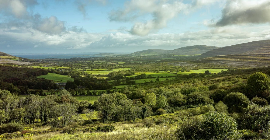 a small field on a mountain overlooking a valley